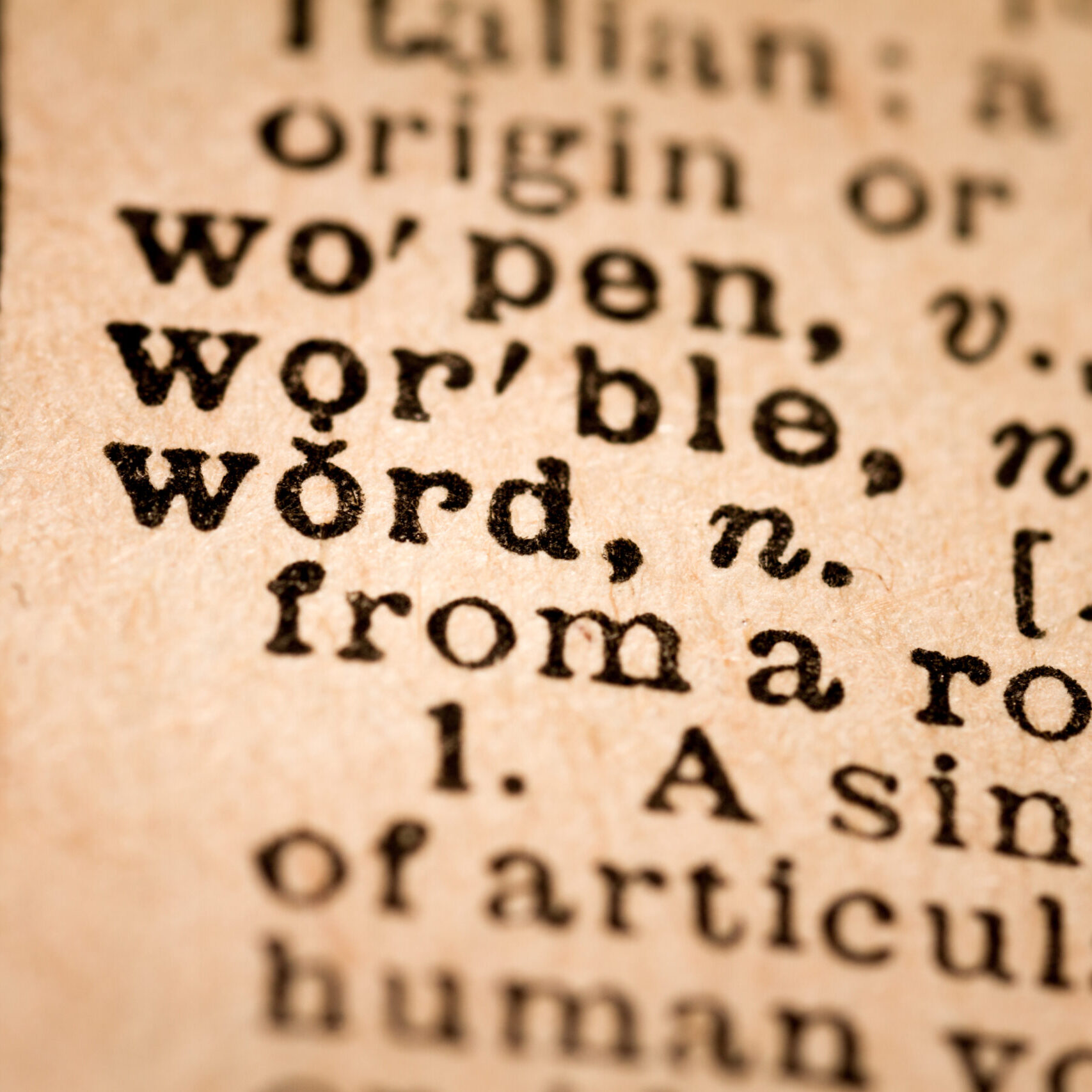 October 1st, 2015 - Montreal, Canada. Close-up of an Old 1945 Webster Vintage Dictionary showing the Word WORD